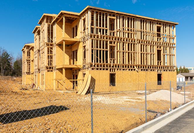 a view of a temporary chain link fence that surrounds a construction site, providing security in Phoenix IL